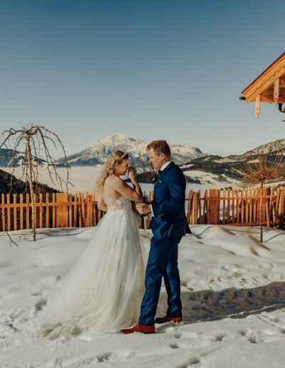 Emotional first look of the bride and groom at their winter wedding in the mountains