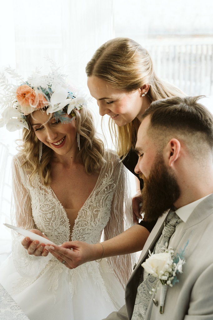 Bridal couple with Wedding Day Manager at their wedding in the mountains