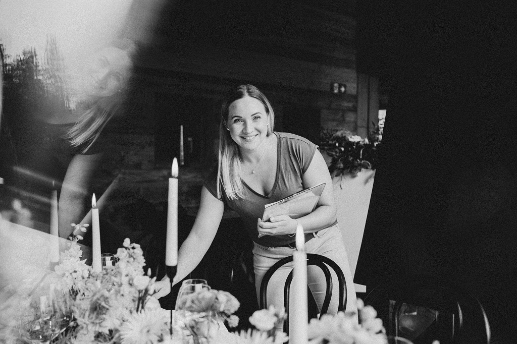 Master of ceremonies at a mountain wedding checking the seating arrangements