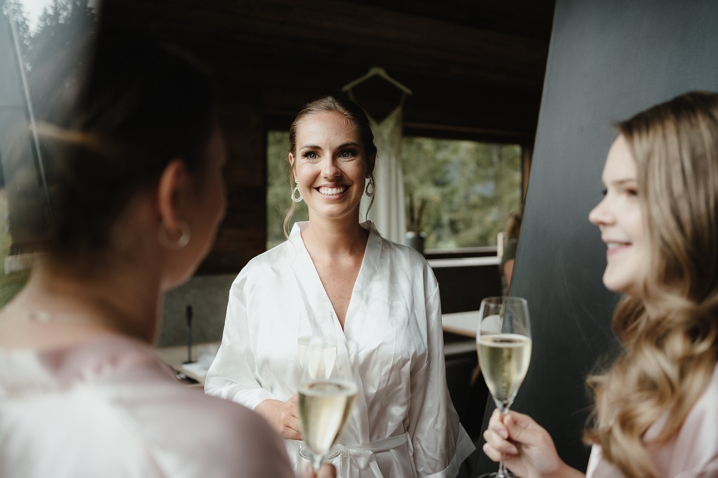 Relaxed bride getting ready at her mountain wedding in the Alps