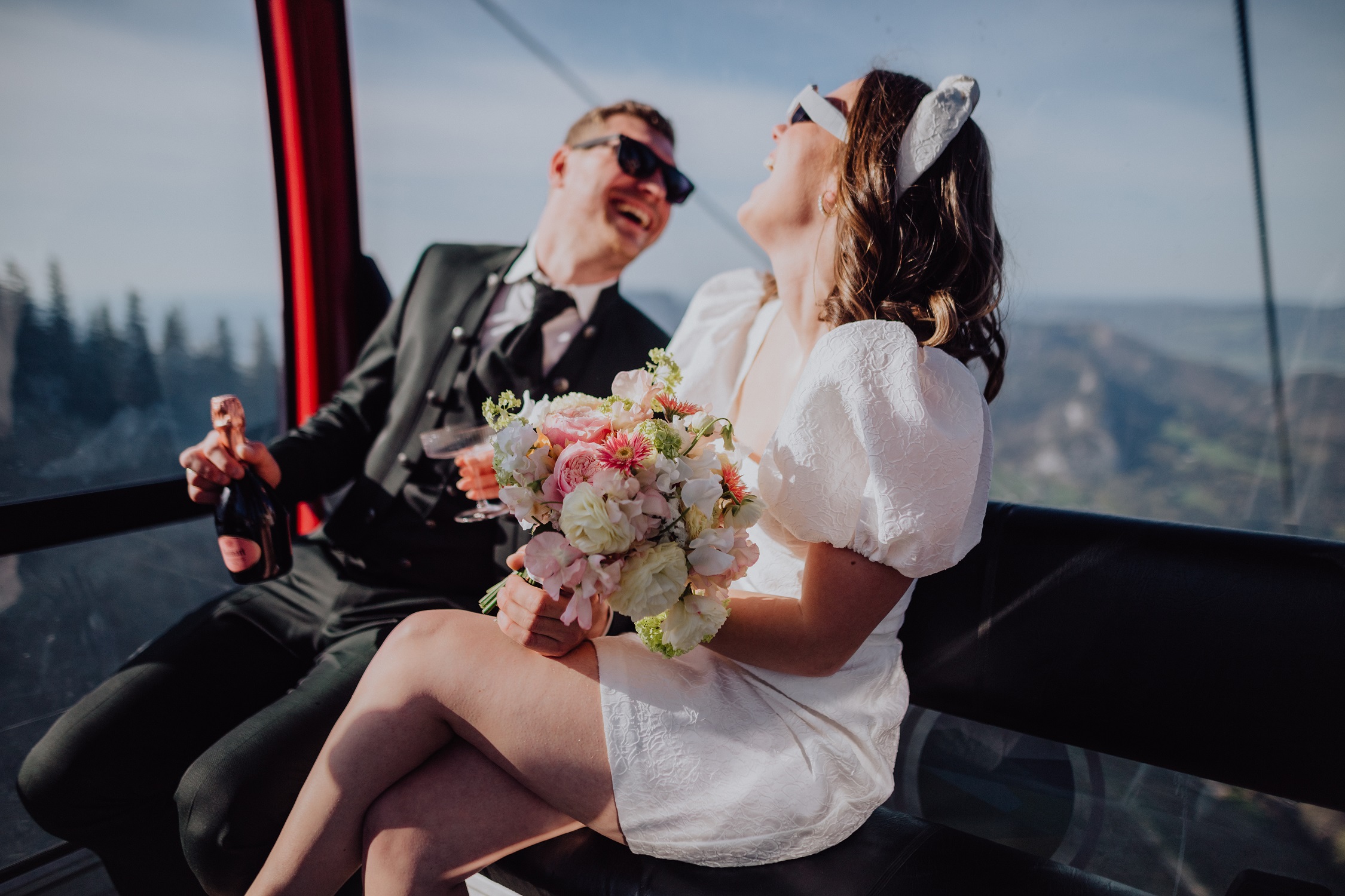 Ronja Weddings Wedding Planning Austria Allgäu Mountains Alps Partial Planning Master of Ceremonies Location Search Bridal couple in the gondola at their mountain wedding in Austria