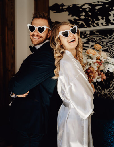 Cool bridal couple getting ready at their mountain wedding