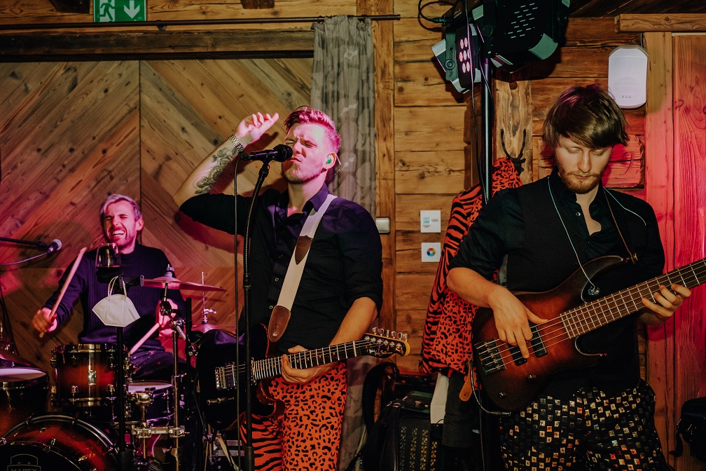 Band at the party of a mountain wedding in winter on the Jufenalm