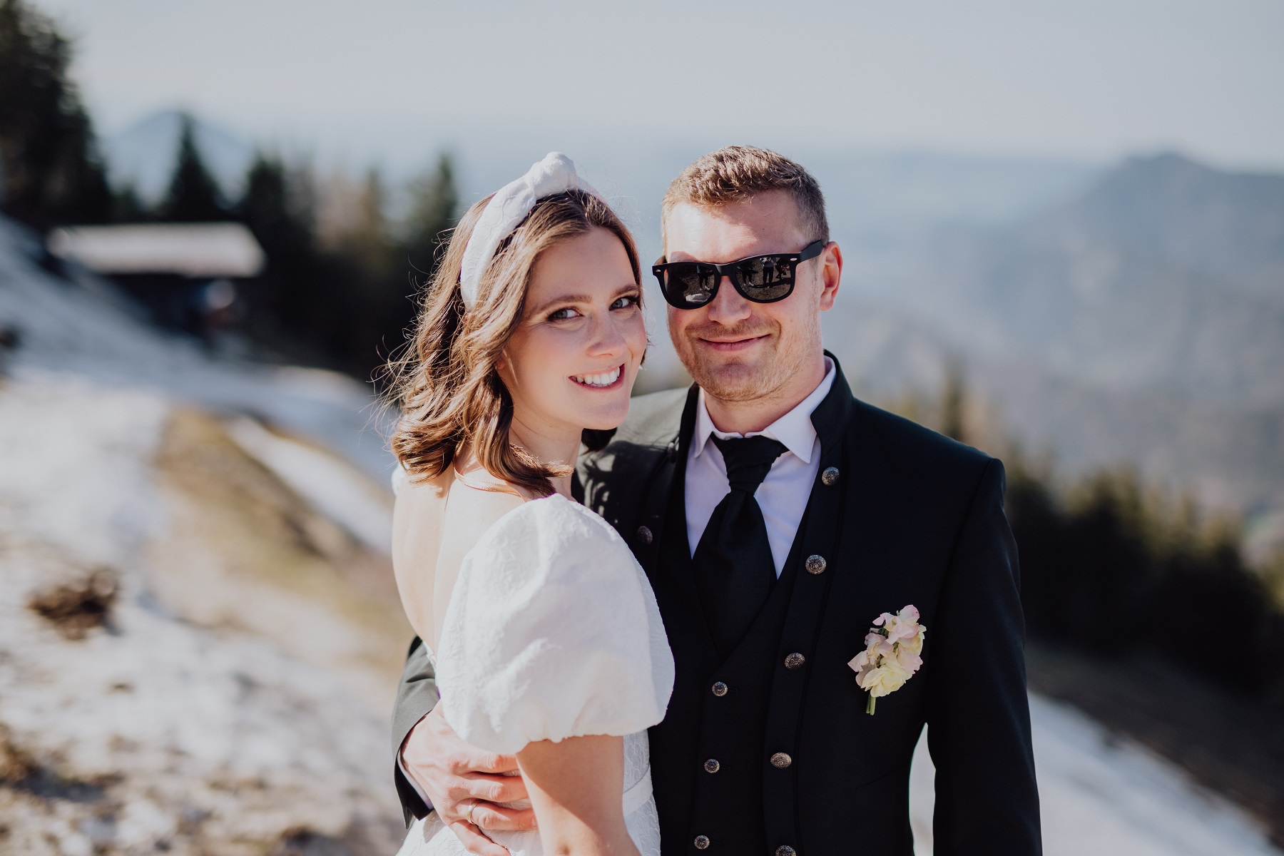 Happy bridal couple at their wedding on the Zwölferhorn in the mountains of Austria