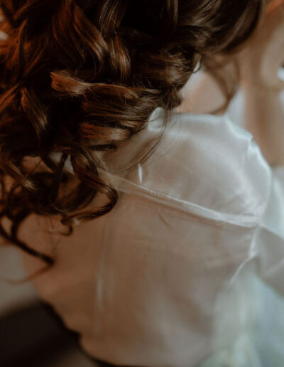 Bride getting ready in Tyrol against a wintry mountain backdrop