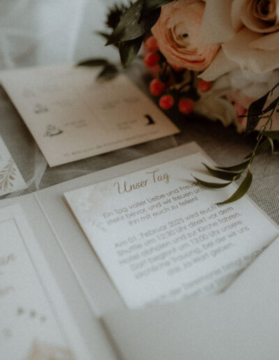 Stationery and invitation card as a flatlay for a mountain wedding