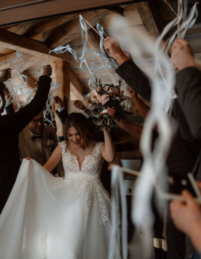 Bridal couple entering the wedding location in the mountains
