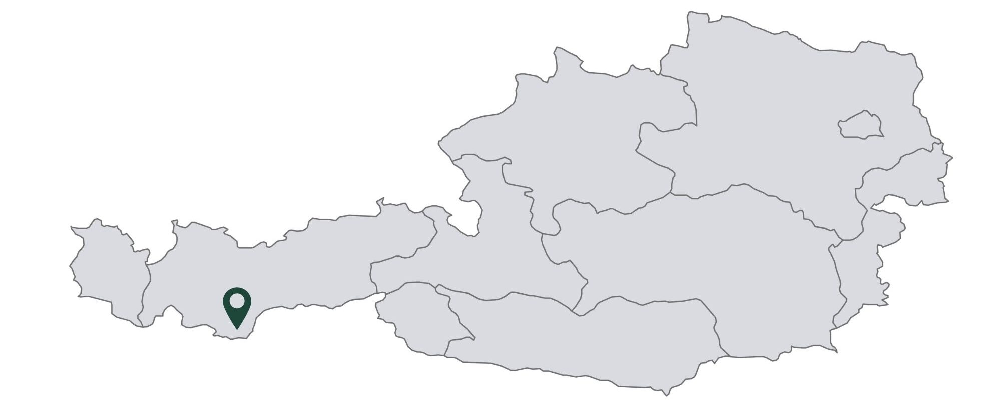 Karte von Österreich mit einer Standortnadel, die einen Ort in der südwestlichen Region markiert und Tirol hervorhebt - perfekt für die Planung Ihrer Berghochzeit oder einer zauberhaften Winterhochzeit.